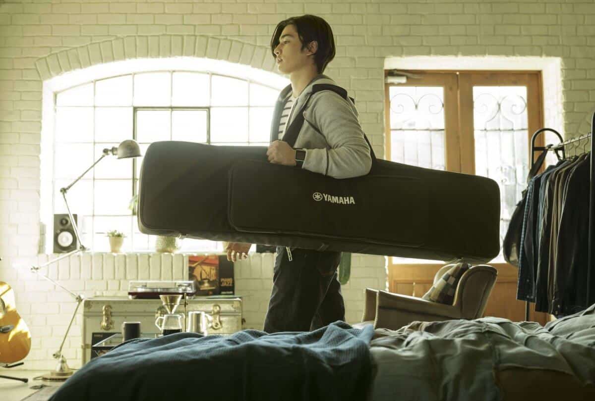 The Yamaha P125 in a gigbag being taken to a live stage performance